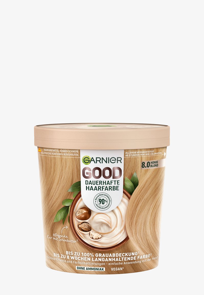 Couleur de cheveux permanente Garnier dans un contenant rond beige. Présente des accents verts et des images de beurre de karité et de noix. Teinte 8.0 Blond Miel.