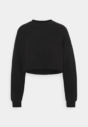 Sweat-shirt court noir à manches longues, col ras du cou et poignets côtelés, présenté sur un fond blanc uni.