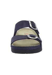 Navy blue sandal with two wide straps, silver buckle detail, cushioned beige footbed, and black rubber outsole. Flat design for easy wear.
