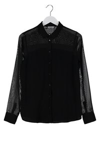 Black long-sleeve shirt with a collared neck and button front. Sheer texture along the sleeves, solid fabric on the body, and cuffed wrists.