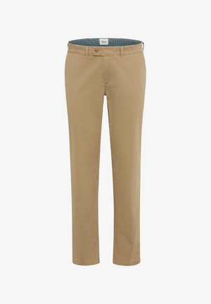 Beige bomulds chinos med slim fit, lige ben og knaplukning. Indersiden af taljebåndet har et mønstret blåt stofdetalje.