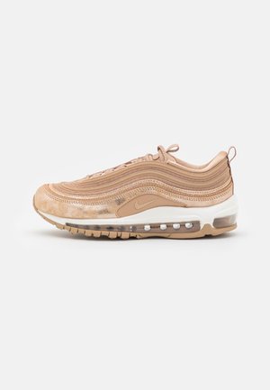 Nike Air Max 97 Sneaker in hellem Beige. Verfügt über ein gewelltes Design mit strukturierten Overlays und einer sichtbaren Air-Einheit in der Sohle. Gummisohle.