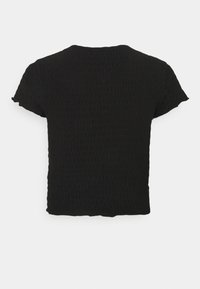 Black textured short-sleeve blouse with a slightly cropped fit and subtle gathered details on a plain background.