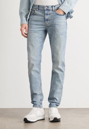 Jeans in denim azzurro chiaro con vestibilità slim, caratterizzati da un leggero effetto usurato sulla coscia e un classico design a cinque tasche.