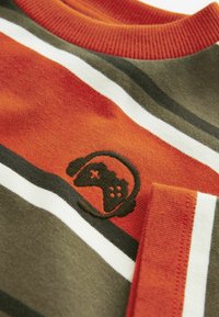 Cotton gaming-themed sweater, featuring vertical stripes in orange, green, and white. Black embroidered gaming controller icon on the chest.