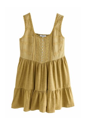 Sárga ujjatlan ruha texturált felsőrésszel, részletes varrással, elülső gombokkal és réteges, fodros szegéllyel.
