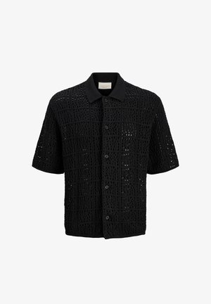 Chemise noire à manches courtes avec boutons, motif en maille ajourée formant des carrés et un col uni.