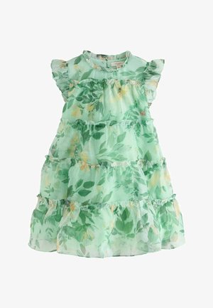 Zöld virágmintás ruha réteges szoknyarésszel, fodros ujjakkal és kerek nyakkivágással. Levélmintával, különböző zöld és sárga árnyalatokban.