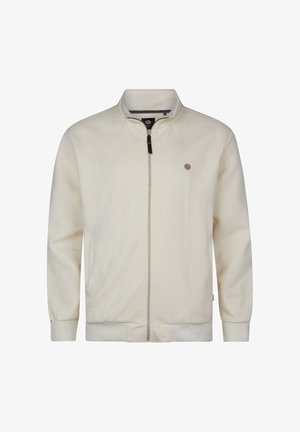 Giacca crema chiaro con zip realizzata in tessuto strutturato con motivo a spina di pesce. Presenta un colletto alla coreana e un piccolo emblema sul petto.