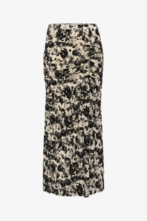 Mustvalge lillemustriga maksiseelik, mis on valmistatud pehmest kangast, omab vooderdatud vööd ja volditud detaile, mis loob voolava silueti.