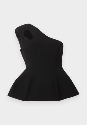 Haut noir asymétrique sans manches avec une découpe près de l'épaule et un ourlet évasé en bas de style péplum, posé à plat sur un fond clair.
