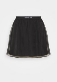 Musta hame, jossa on läpinäkyvä päällyskangas, joustava vyötärö, jossa on 'CALVIN KLEIN JEANS' -brändäys, ja kevyt, virtaava muotoilu.