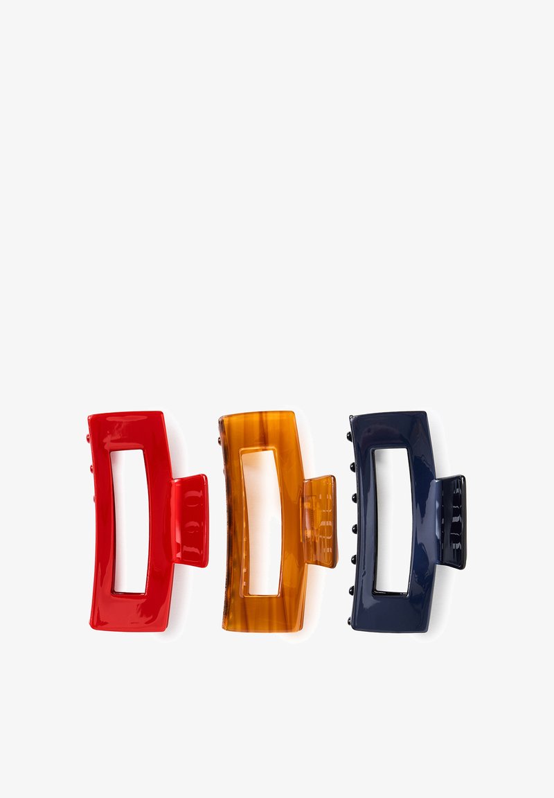 Three rectangular hair clips in red, amber, and dark blue, arranged side by side on a white background.