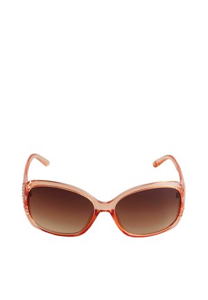 Lunettes de soleil surdimensionnées avec une monture orange transparente, des verres bruns dégradés et des accents décoratifs sur les branches. Texture lisse.