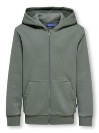 Felpa verde con zip realizzata in tessuto morbido, dotata di una cerniera frontale, due tasche e un cappuccio con coulisse. Polsini e orlo a coste per una vestibilità migliore.