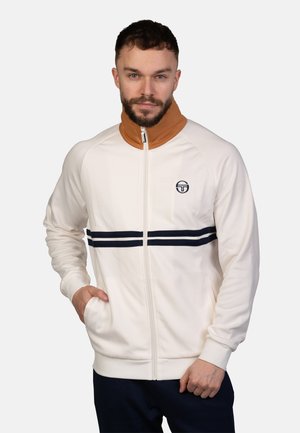 Witte zip-up jas met een bruine kraag, marineblauwe strepen en logo. Beschikt over ribgebreide cuffs en zijzakken, gemaakt van een zachte, rekbare stof.