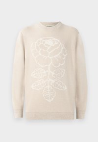 Beige pulóver, középen egy nagy fehér rózsa grafikával. Bordás mandzsettákkal és nyakkal rendelkezik, puha, textúrált kötött anyagból készült.