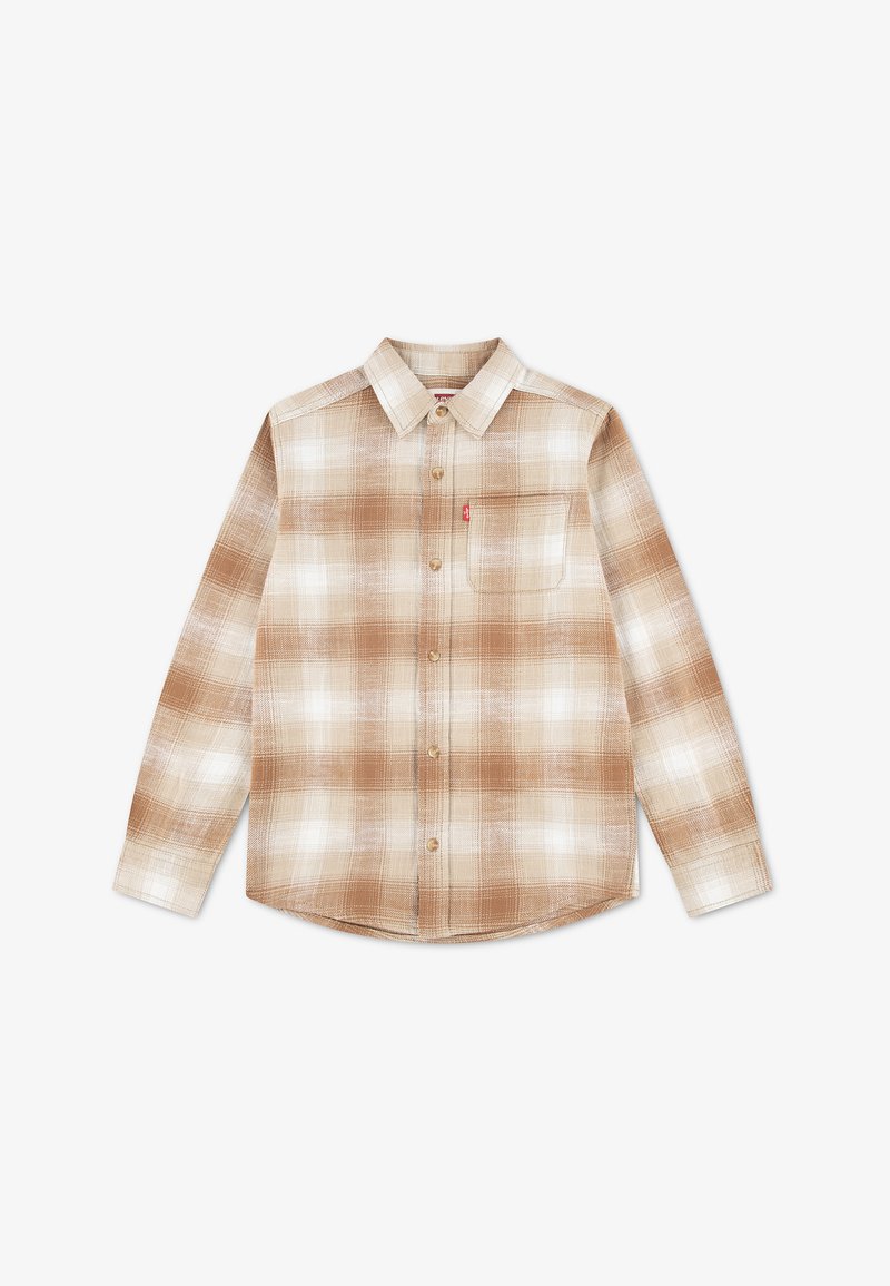 Chemise à manches longues à carreaux beige et blanc, boutonnée, avec col et poche poitrine, dotée d'une petite étiquette rouge sur le côté gauche.
