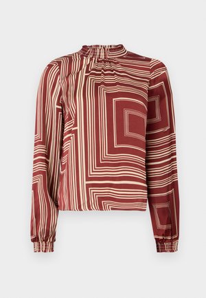 Blouse à manches longues avec un col haut, en tissu bordeaux avec des lignes géométriques crème et des poignets froncés pour un ajustement décontracté.