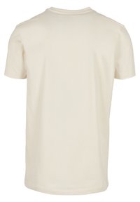 Korte mouwen, crew-neck t-shirt van lichtbeige katoen. Eenvoudig ontwerp zonder zichtbare patronen of accenten op de achterkant.