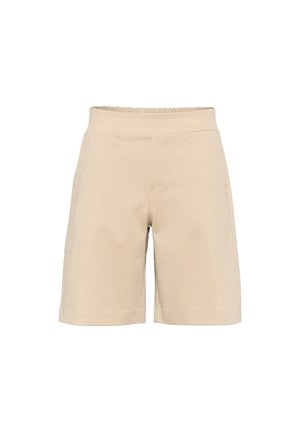 Beige Baumwollshorts mit elastischem Bund, die ein einfaches Design und einen geraden Schnitt aufweisen. Zwei seitliche Taschen sind sichtbar.