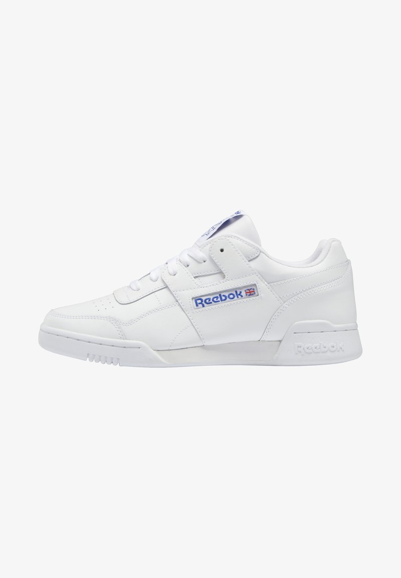 White leather low-top sneakers with a lace-up design, Reebok logo in blue, perforated toe box, and textured rubber sole.