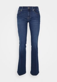 Flared blue jeans made of denim, featuring a high waist, front pockets, and contrasting stitching. The fabric has a smooth texture.
