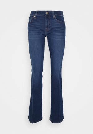 Jeans svasati blu in denim, con vita alta, tasche frontali e cuciture a contrasto. Il tessuto ha una texture liscia.