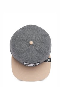 Gray felt cap with a beige flat brim, featuring a logo patch on the front and a button accent on top. Textured surface with visible stitching.
