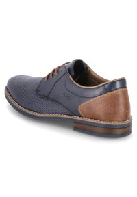 Dark blue leather shoe with perforated texture, brown leather accents, round toe, and lace-up design. Stitched detailing on sole and heel.