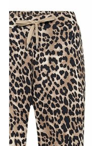 Jogginghosen mit Leopardenmuster in Beige und Schwarz, aus weichem Stoff, mit elastischem Bund und Kordelzug sowie schmal zulaufendem Bein.