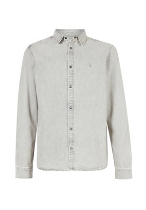 Lys grå langærmet skjorte i denimstof med knaplukning, spidse krave og lille broderet logo på venstre bryst.