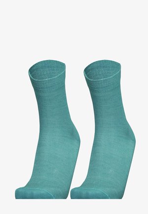 Turquoise cotton socks with a ribbed texture, ankle length, and a reinforced heel. Smooth finish with a subtle sheen.