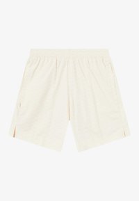 Light beige shorts with an elastic waistband, side pockets, subtle embossed pattern, and slits at the hem for ease of movement.