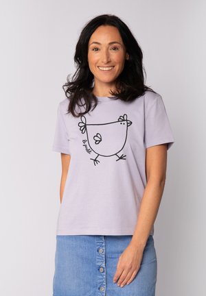 Lila t-shirt van katoen met een zwarte omtrek van een kip en de tekst "le poulet." Ontspannen pasvorm met korte mouwen.