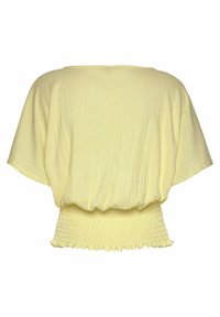 Top giallo a maniche corte con vestibilità ampia, tessuto strutturato e orlo arricciato. Materiale morbido e leggero.