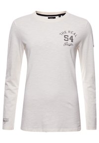 Vit långärmad t-shirt i lättviktsmaterial. Har grafiken "THE REAL 54" i mörkgrått på vänster bröst och en liten logotyp på ärmen.