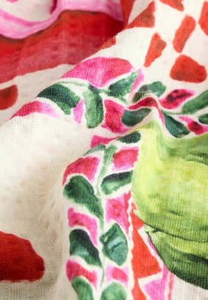 Tessuto multicolore con vivaci motivi floreali in rosa, rosso, verde e bianco. Texture morbida con un design organico e fluido.