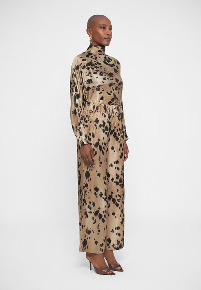 Long, leopard-print dress in shiny gold and black fabric, featuring a high neckline, long sleeves, and a cinched waist.