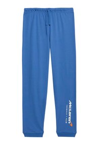 Niebieskie spodnie dresowe wykonane z miękkiego materiału, z elastycznym paskiem w talii i sznurkiem oraz logo zespołu McLaren Formula 1 nadrukowanym na biało i pomarańczowo.