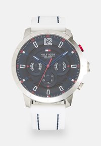 Silver-tone men's watch with a dark dial, white silicone strap, and red accents. Features date, day display, and stopwatch functions.