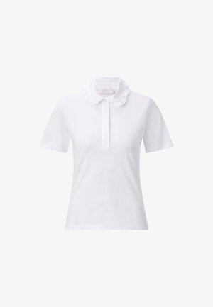 Polo shirt bianco a maniche corte in cotone, con colletto arricciato e una mezza chiusura con bottoni sul davanti.