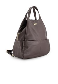 Brown leather backpack with a textured finish, featuring dual top handles, a front zip pocket, and adjustable straps for a comfortable fit.
