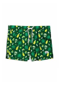 Costumi da bagno verdi con un motivo di bottiglie gialle, teschi, lime e piante tropicali, con un laccetto bianco e tasche laterali.