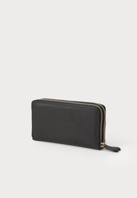 Black leather wallet with textured surface, rectangular shape, gold zipper detailing, and a small zipper pull tab.