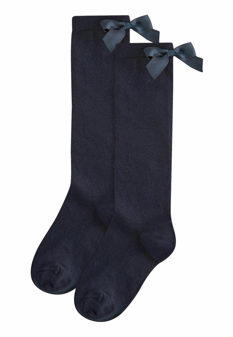 Calze alte fino al ginocchio in maglia blu scuro, con due fiocchi decorativi nella parte superiore. Texture liscia con design senza cuciture alla punta.