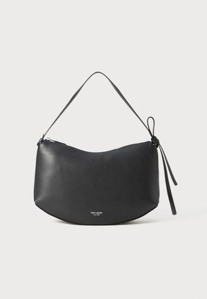 Black leather shoulder bag with a curved shape, zip closure, and a knotted strap. Features a subtle logo at the front. Smooth texture.