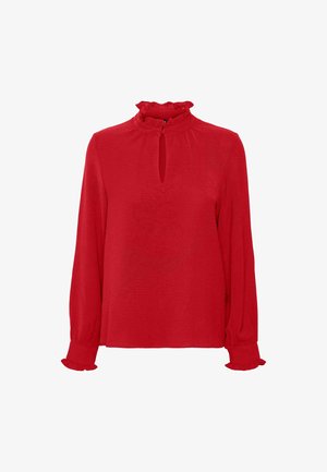 Blusa rossa a maniche lunghe con colletto alto a frange, apertura a chiave sul davanti e polsini a frange.