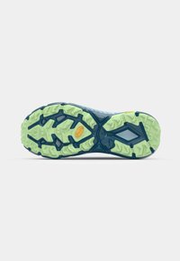 Blue athletic shoe sole with a textured pattern, featuring green and dark blue rubber, and a central logo on a light area.