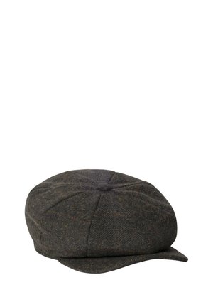Flat cap made of dark grey herringbone wool, rounded top, small visor, and button detail on the crown. Textured fabric with subtle color variations.